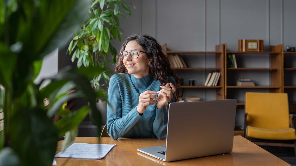 an HR professional looks out a window