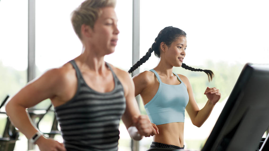 women running on treadmills