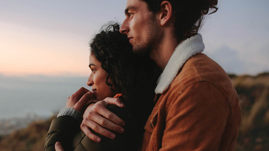 a couple hugs outside