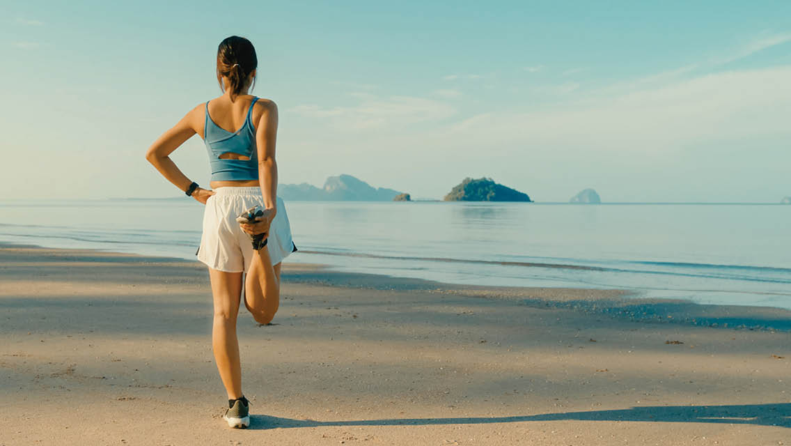 a person stretching out side in preparation for a run