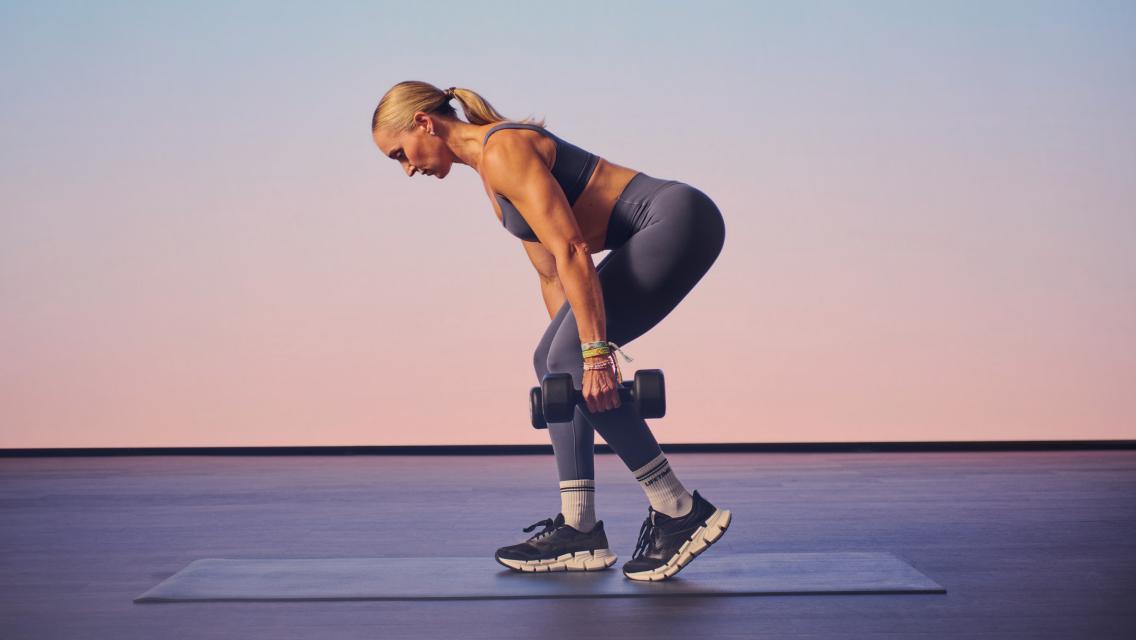 woman holding a weight