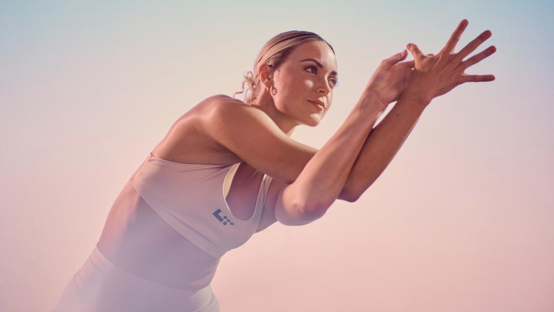 woman stretching her arms out in front of her