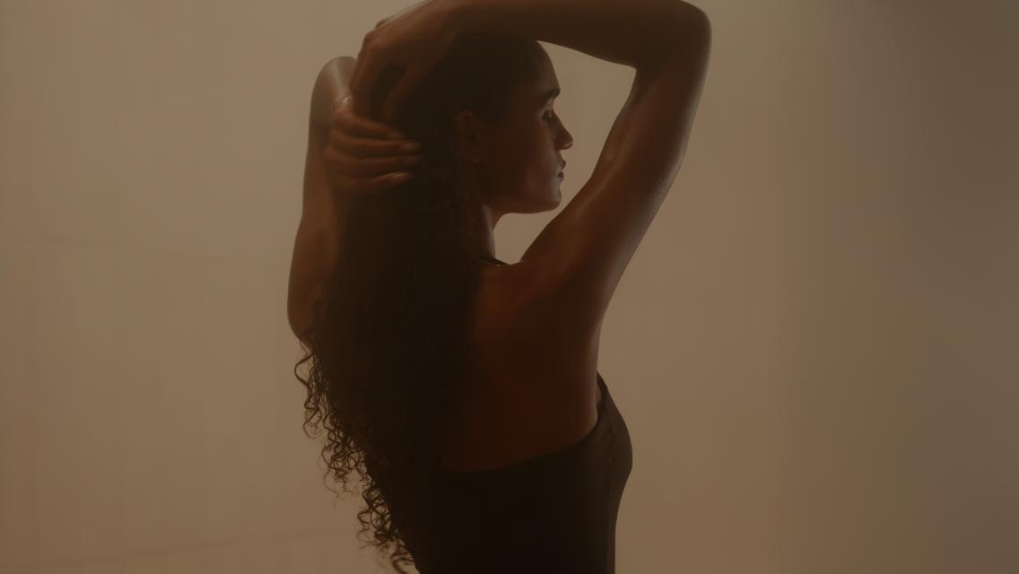 woman with hands in hair