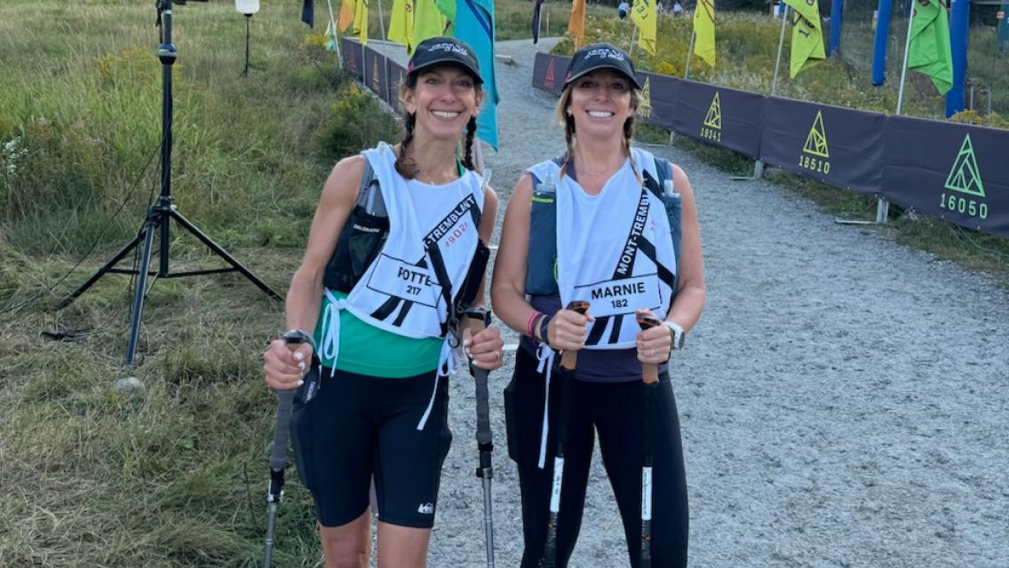 women holding hiking poles