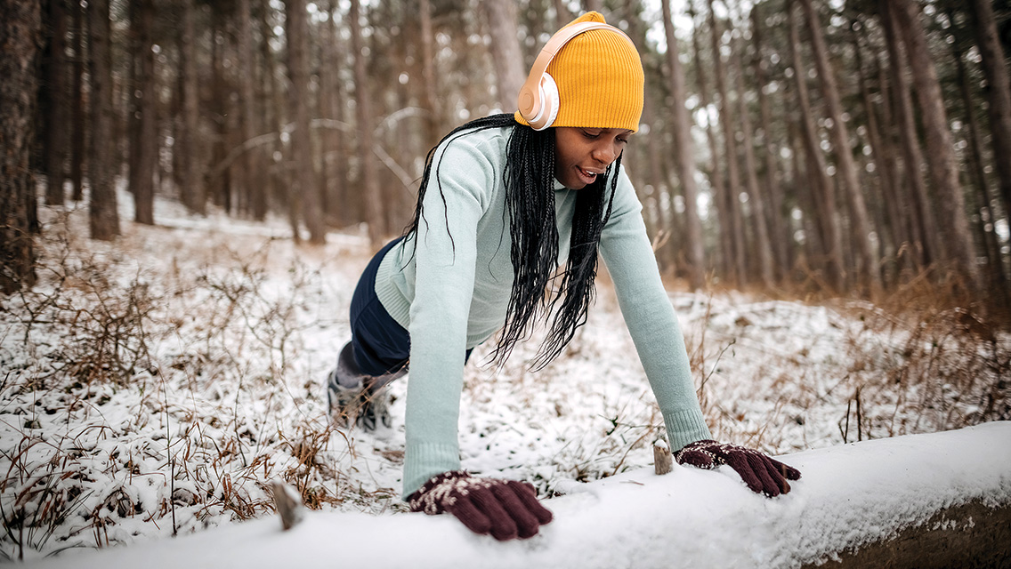 a woman doing pushups outside
