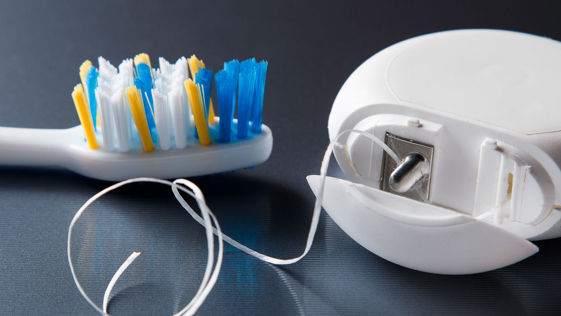 a toothbrush and dental floss