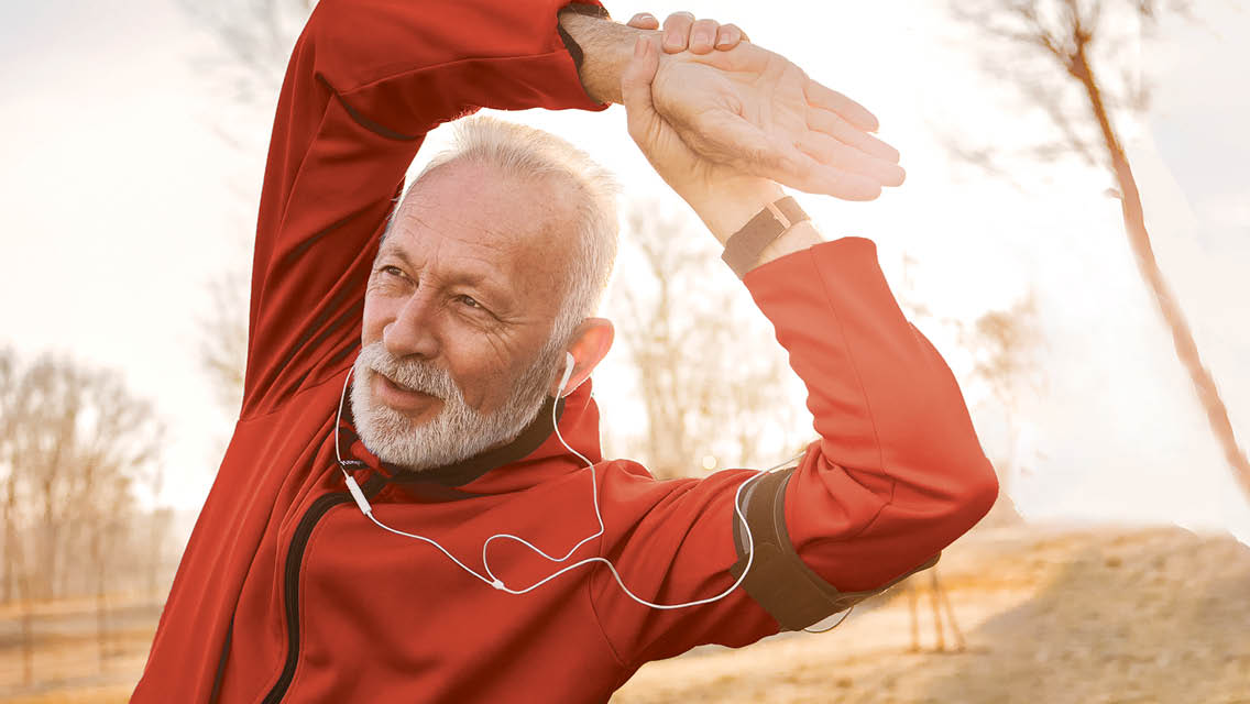 a man stretches outside