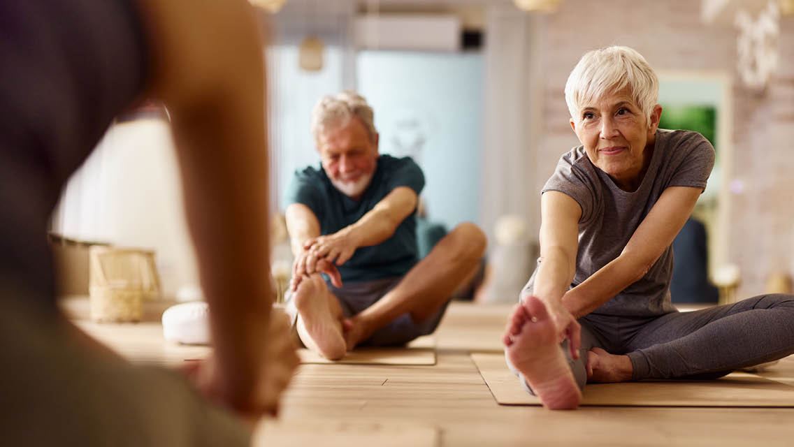 seniors take a yoga class
