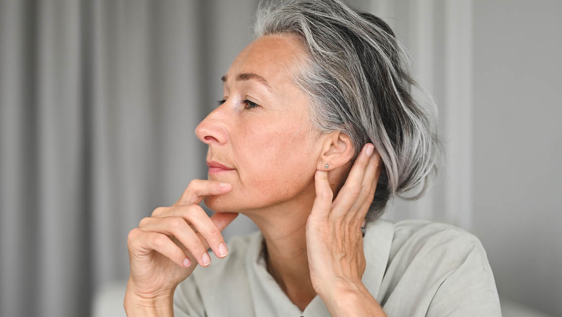 a woman shows her ear