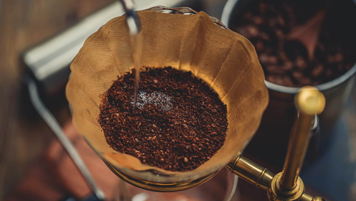 water being poured in coffee grounds