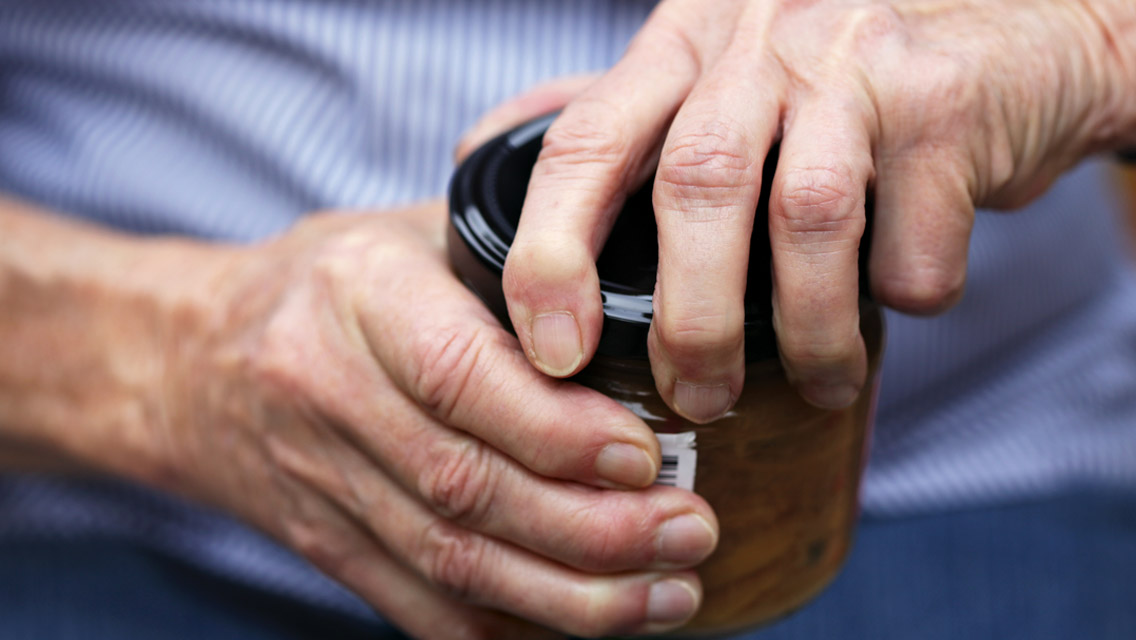 hands opening a jar