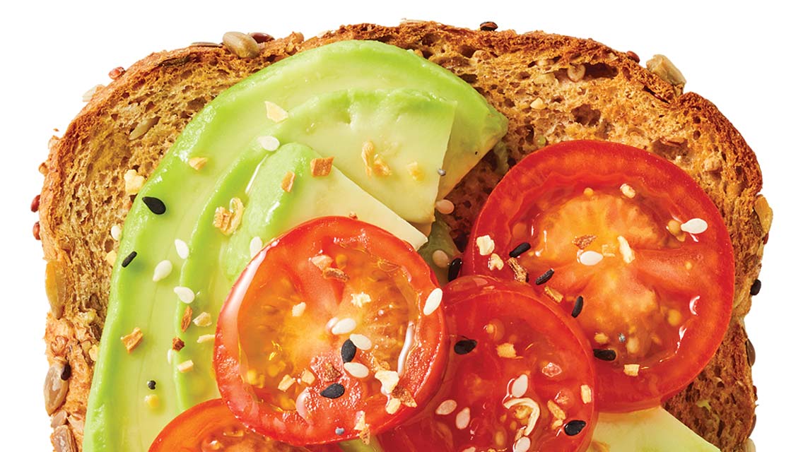 toast topped with avocado and tomatoes