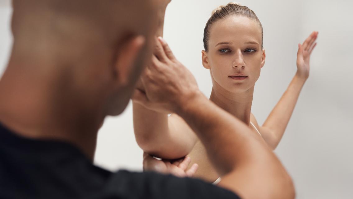 woman with hands out to her side