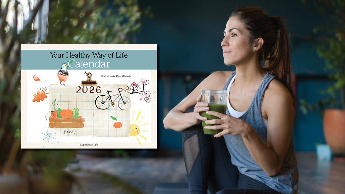 Woman drinking a green detox smoothie at the gym with the healthy way of life calendar ebook