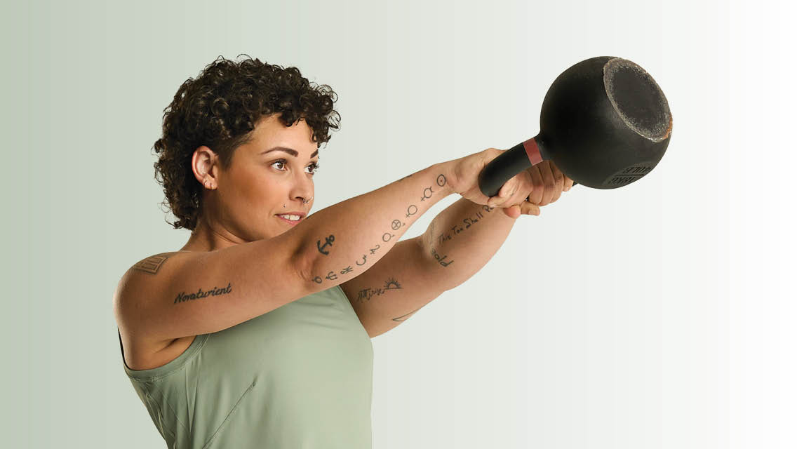 woman performing kettlebell swing