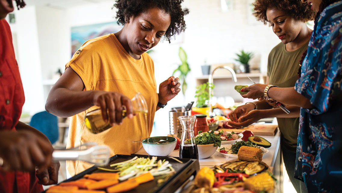 friends cook a meal together