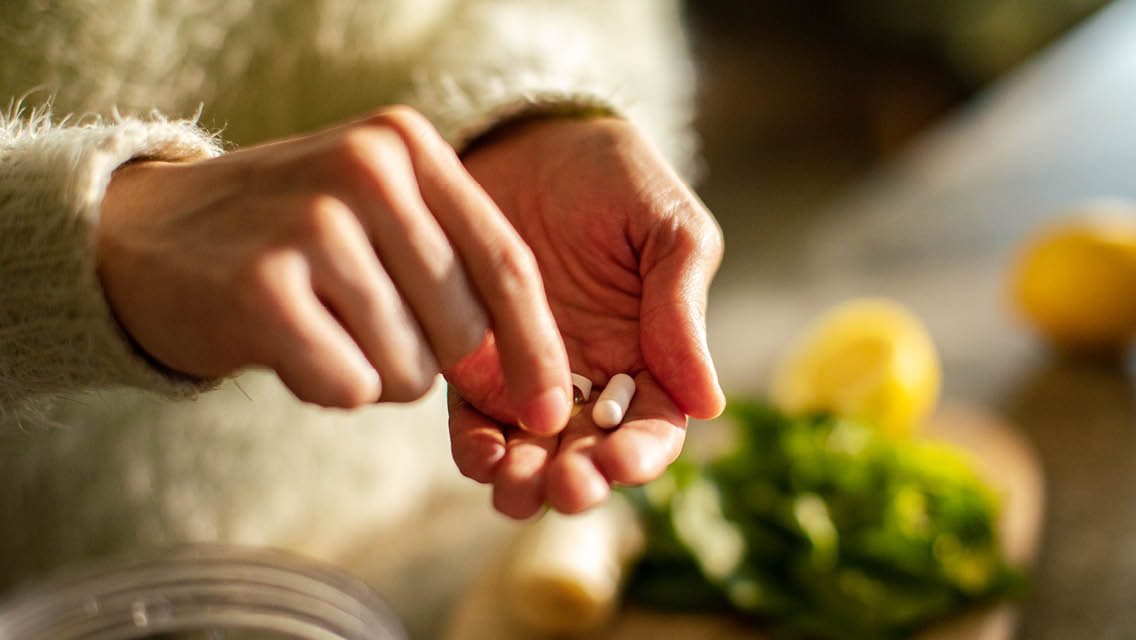 a person taking supplements