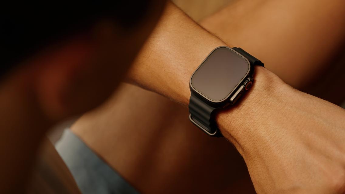 person looking at watch on their wrist