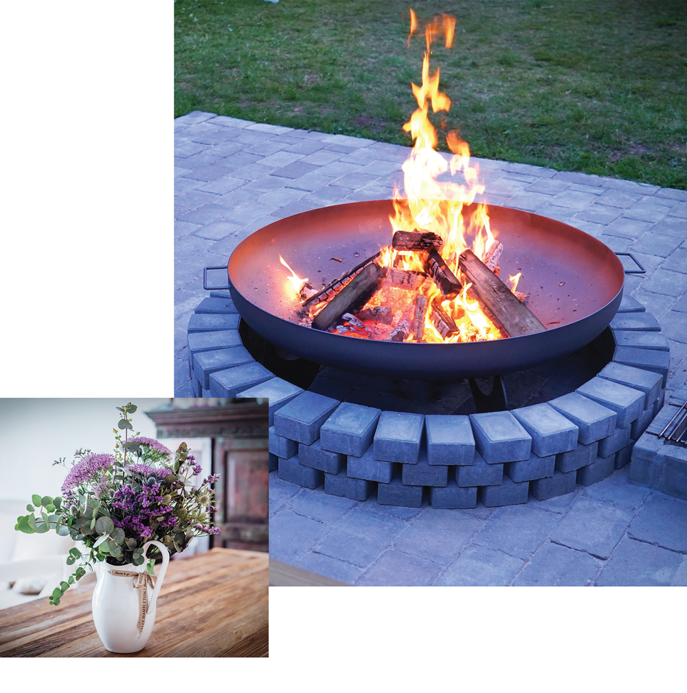 a fire pit and vase of flowers