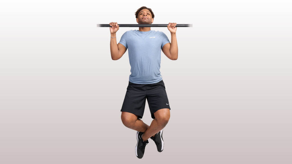a man performs a pull up