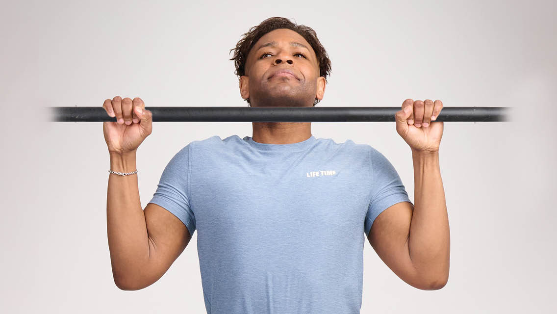 a man performs a pull up