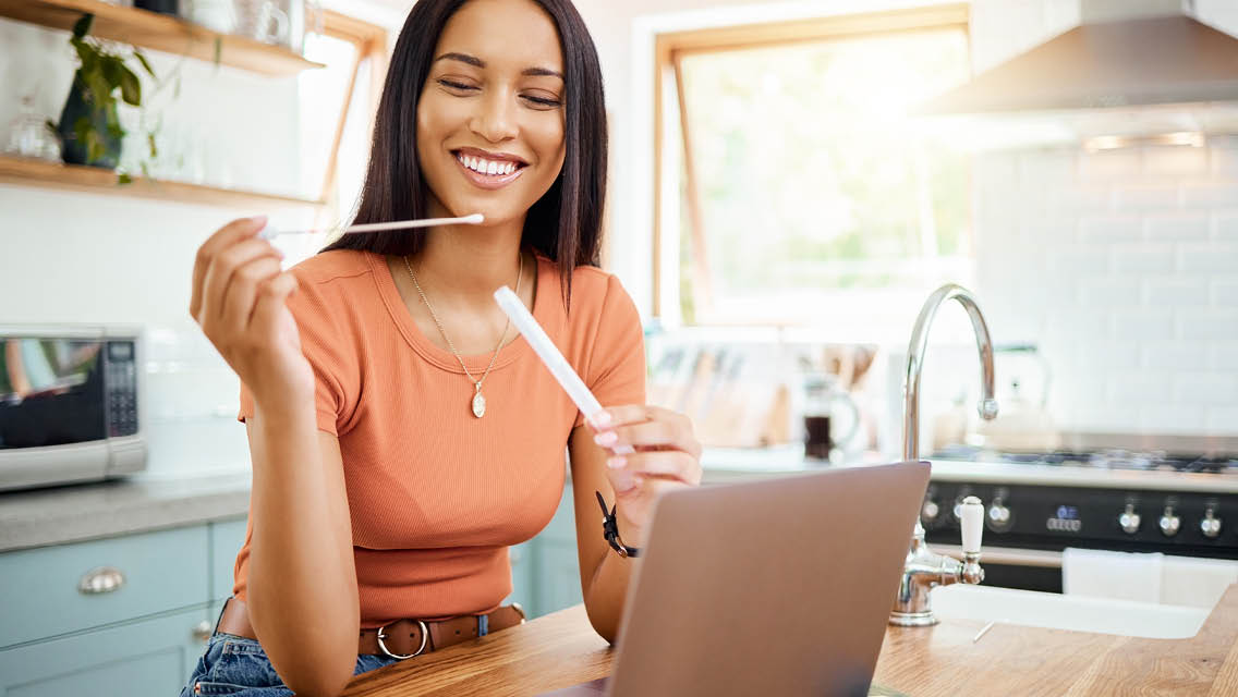 a woman prepares to take a home health test