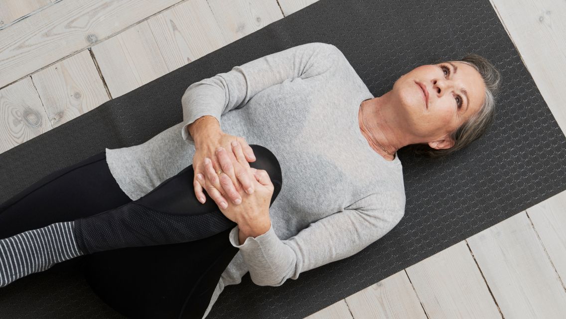 woman on her back stretching