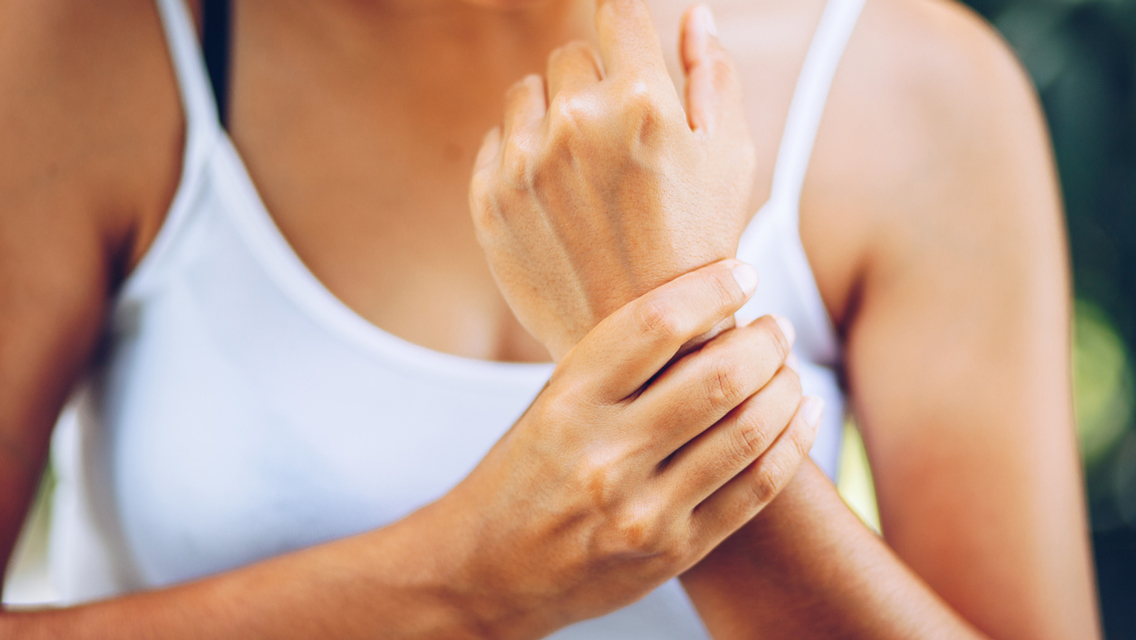 person holding wrist