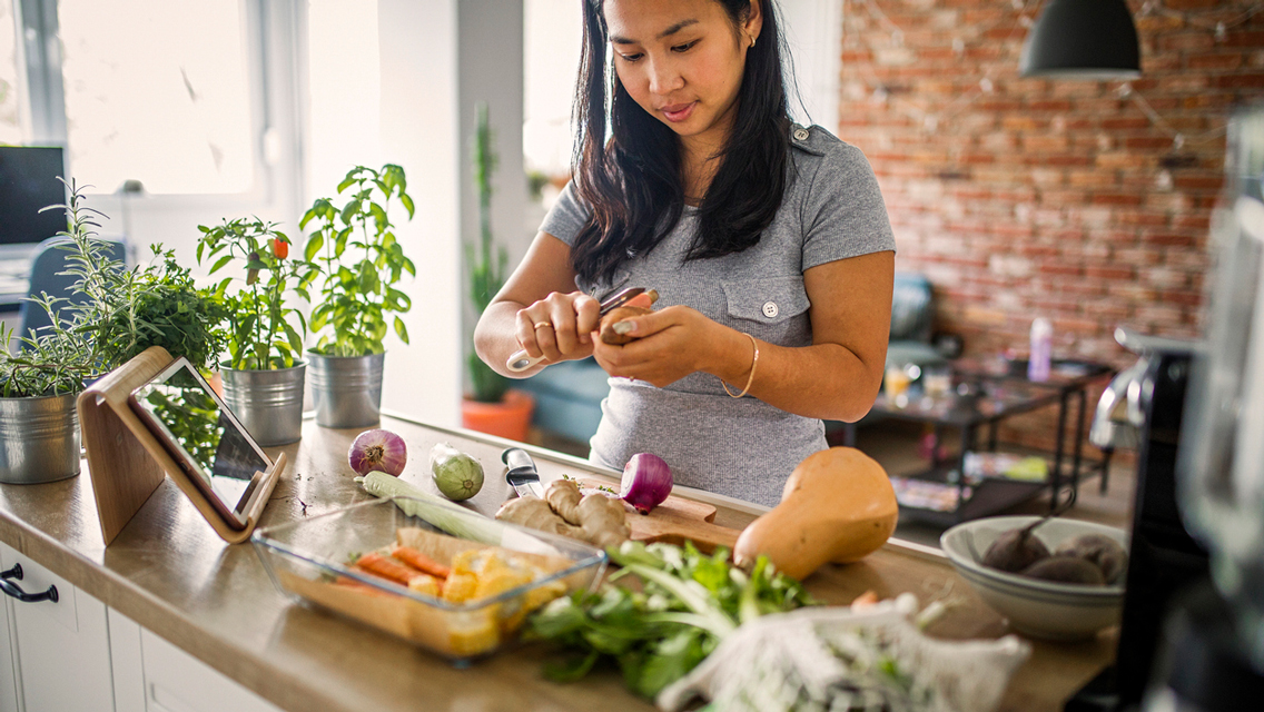 woman preparing meal in kitchen