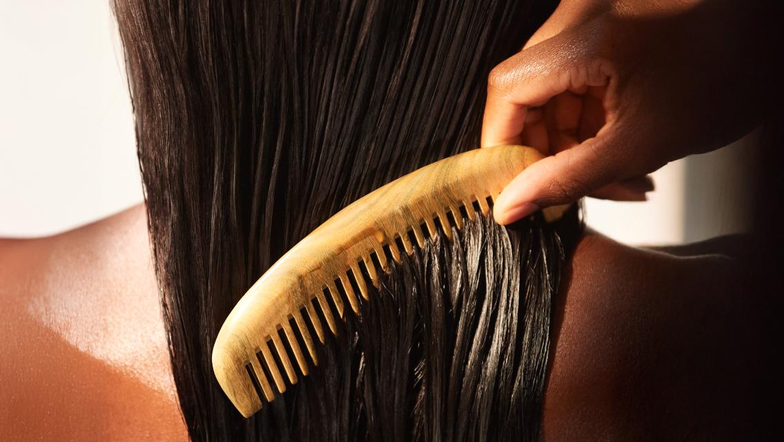 comb going through wet hair