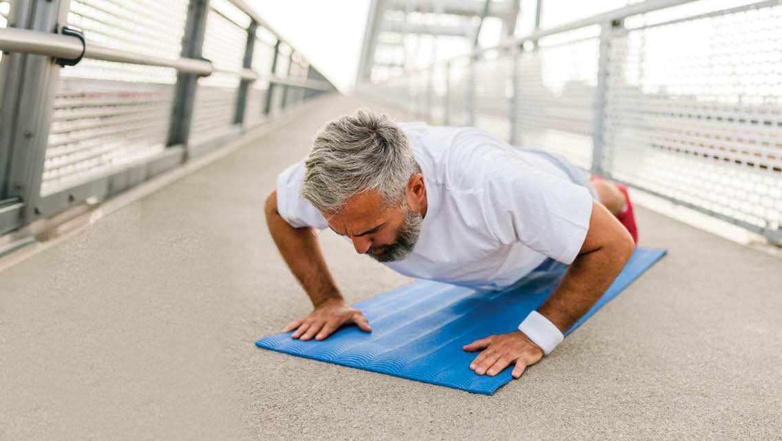 a man in the middle of a burpee
