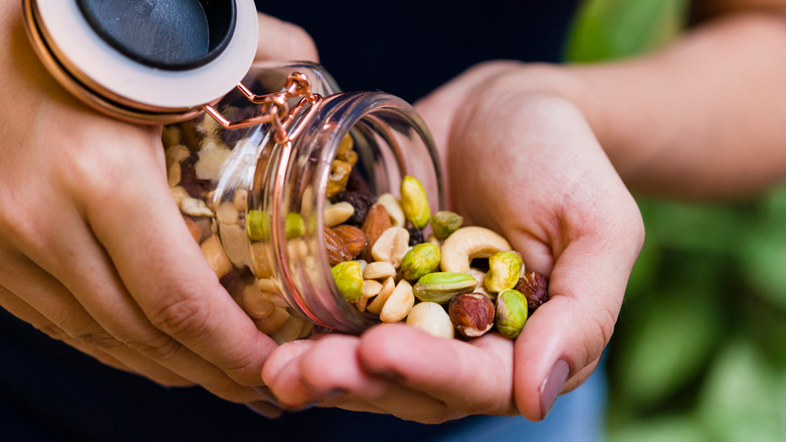 hands dumping nuts