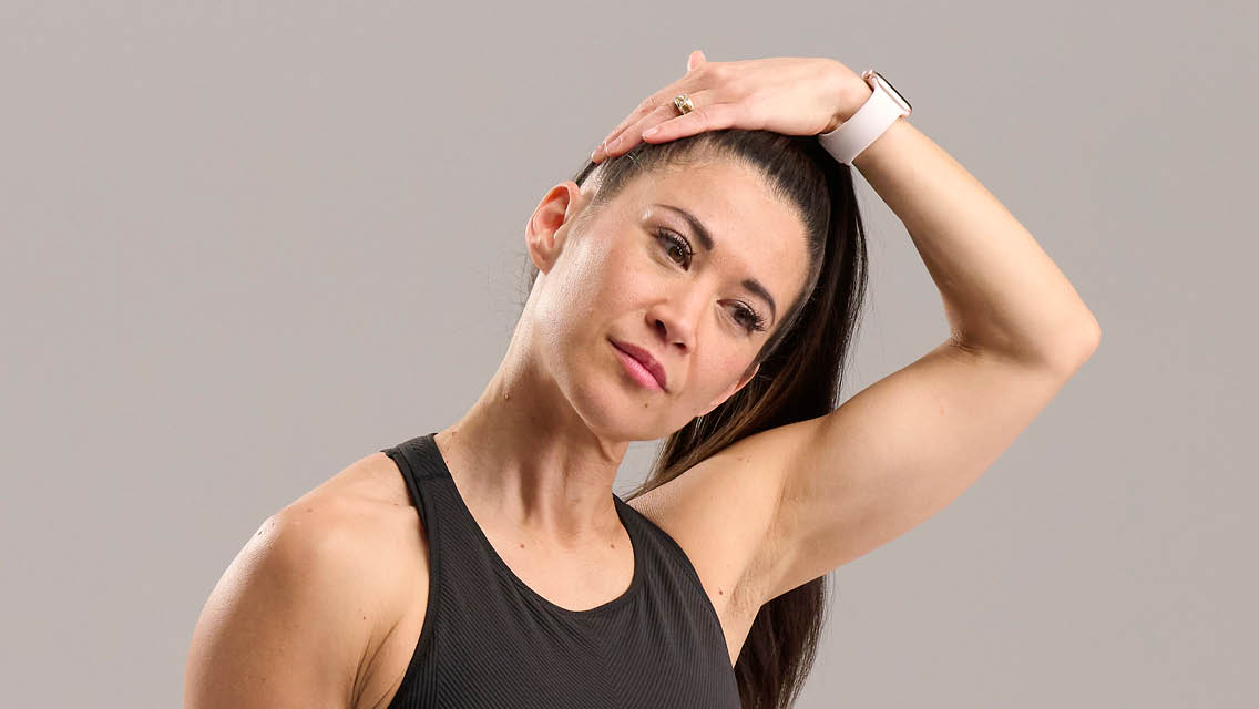 a woman stretches her neck