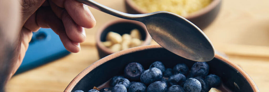 a bowl of oatmeal with berries.