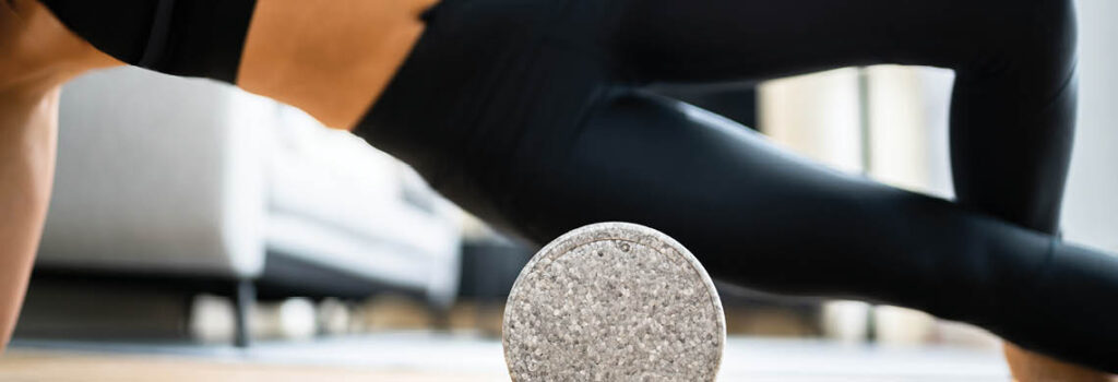a person foam rolling.