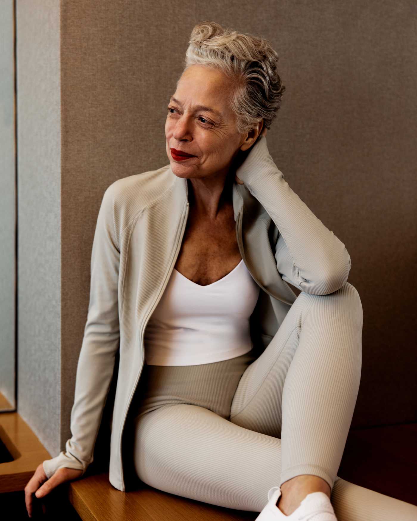 An older woman in workout wear.
