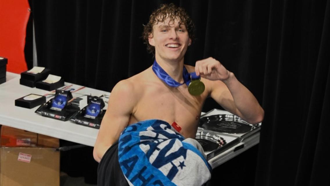 jordan raglund holding up a medal