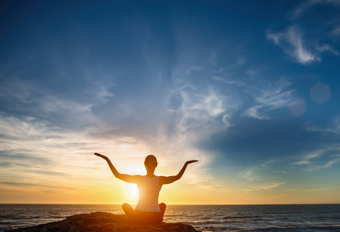 a woman at sunset