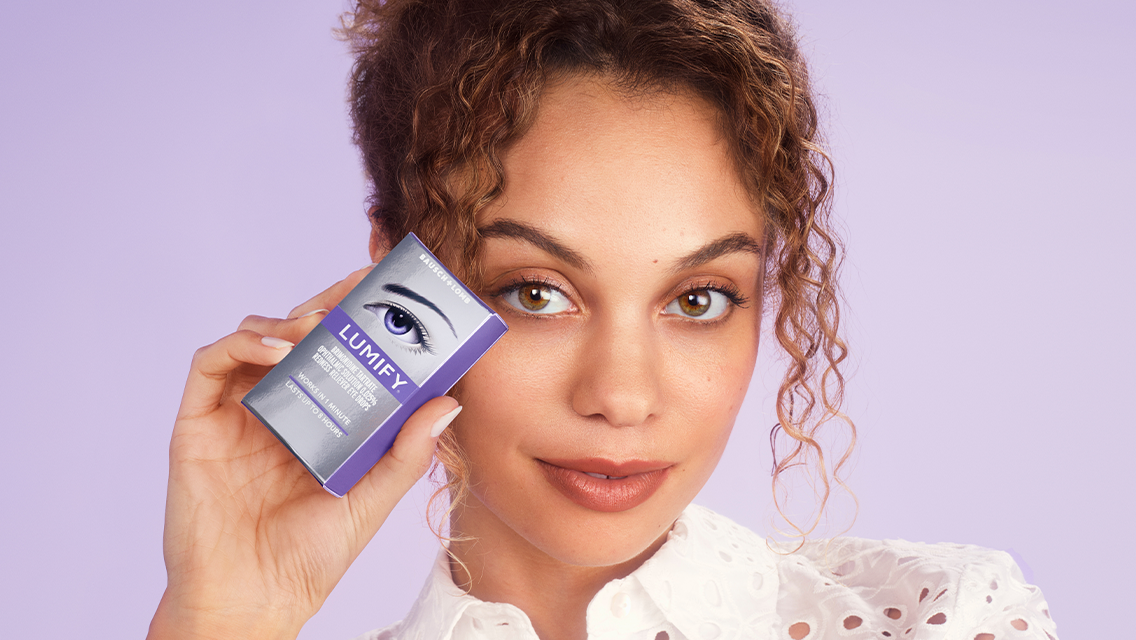 a woman hold lumify eye drops