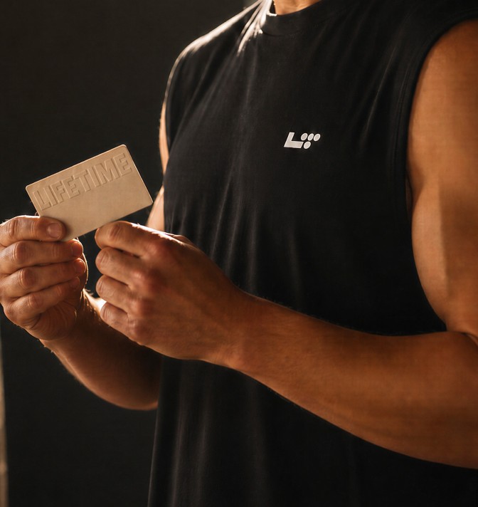 man holding life time giftcard