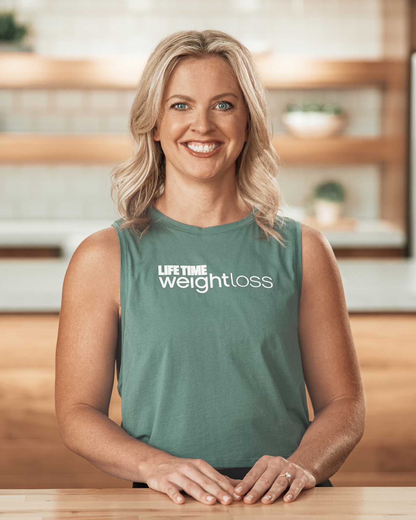 Coach Anika Christ in a kitchen setting.