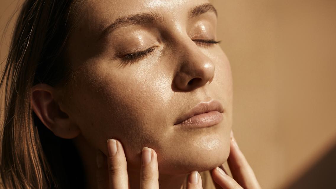 woman with hands on face