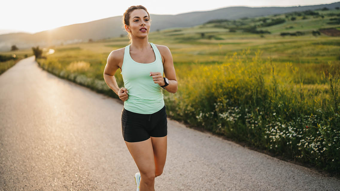 a person running on a country road