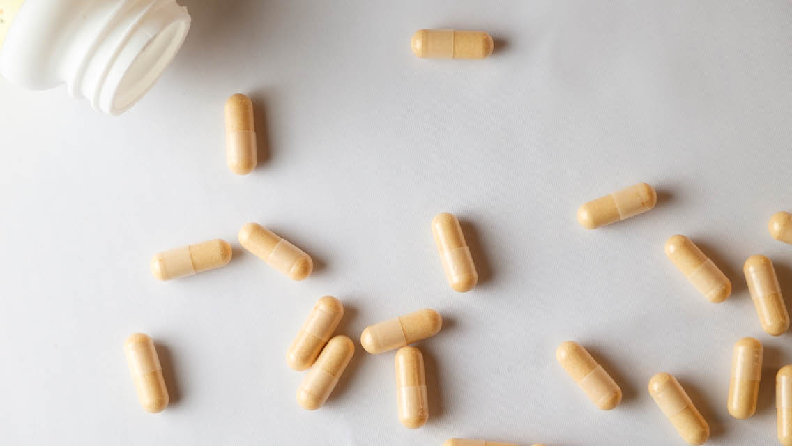 supplements strewn on a counter