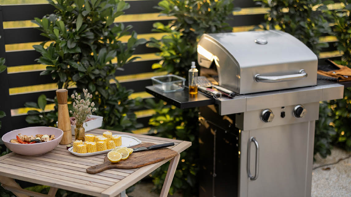 a grill and table of food