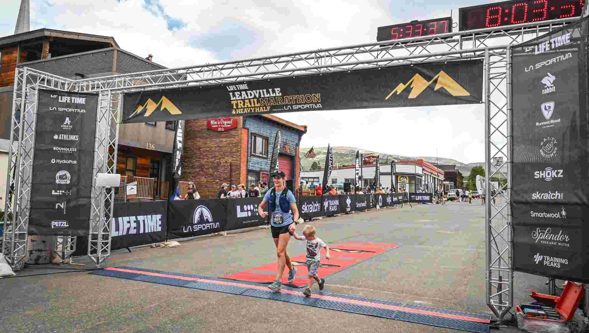 Woman crossing the finish line of a race.