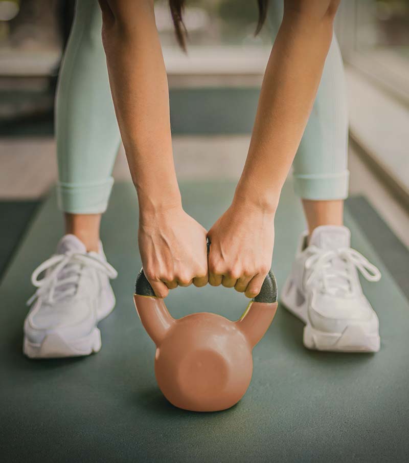 woman with kettlebell