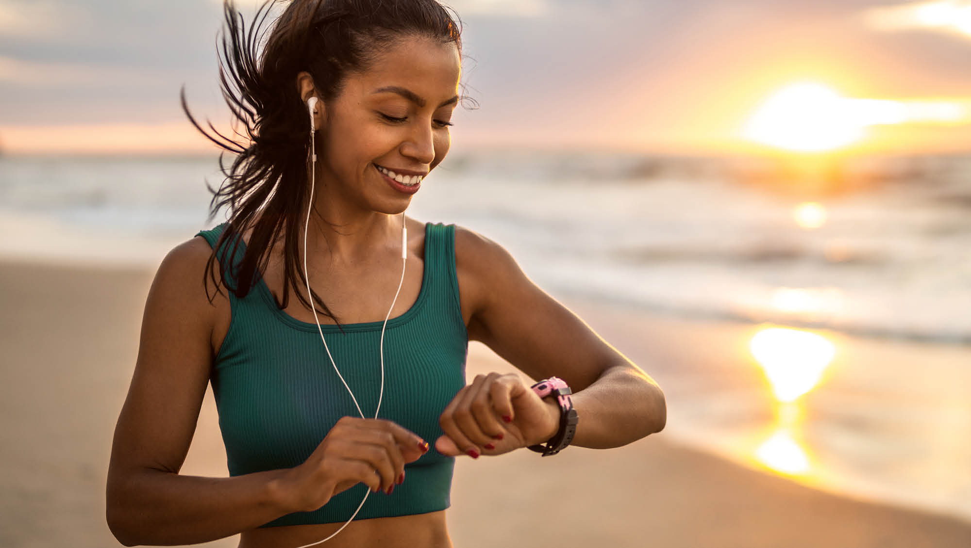 a woman looks at her fitness watch