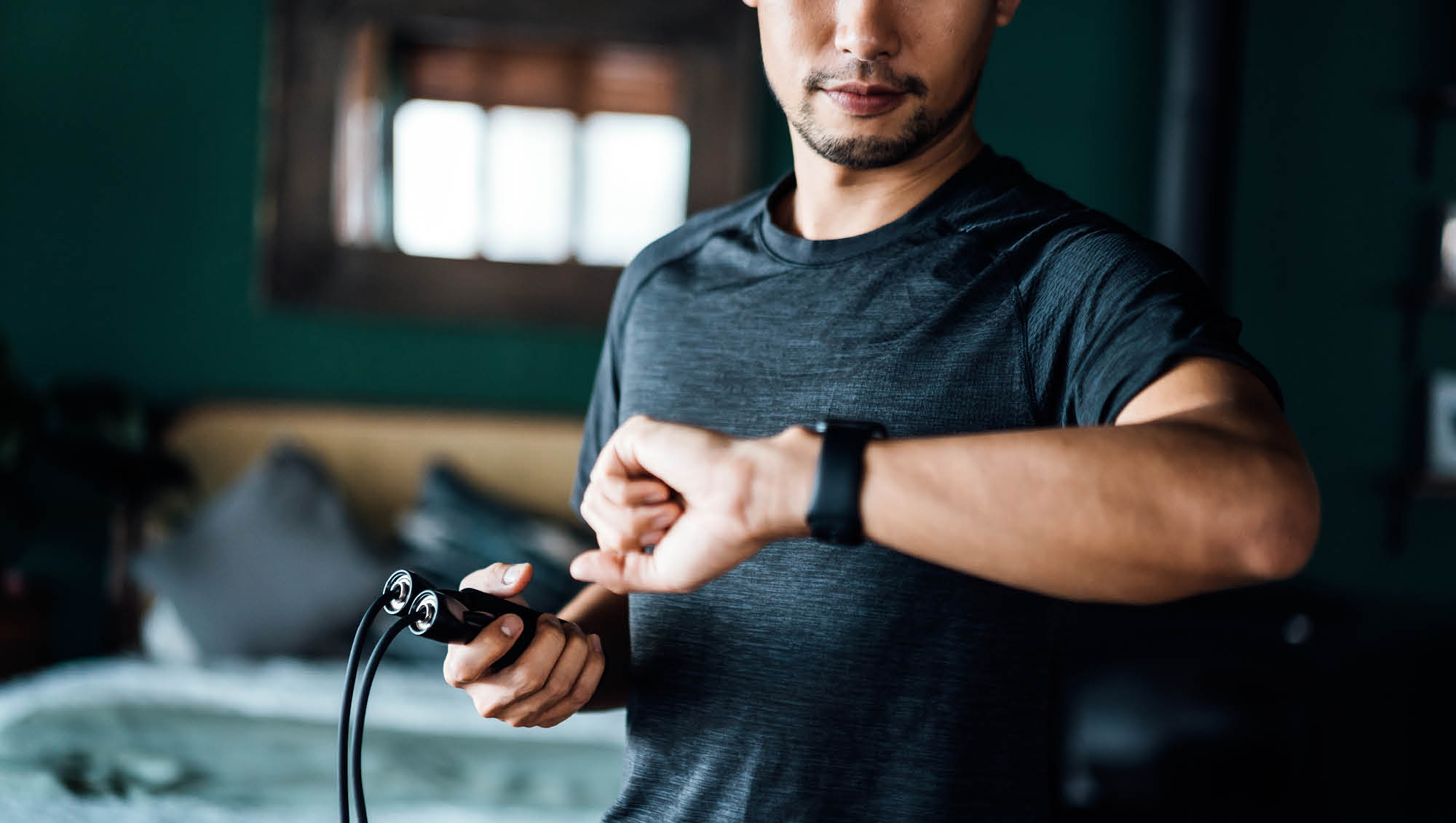 a man checks his smart watch