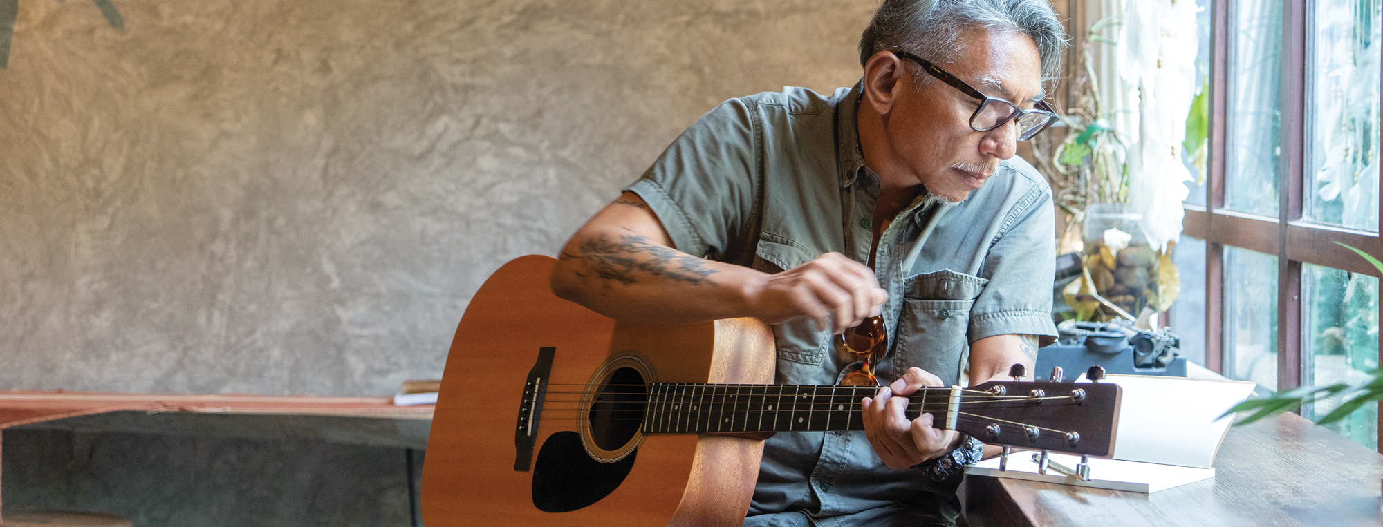 a man plays a guitar